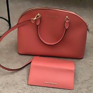 Michael Kors satchel and matching wallet.